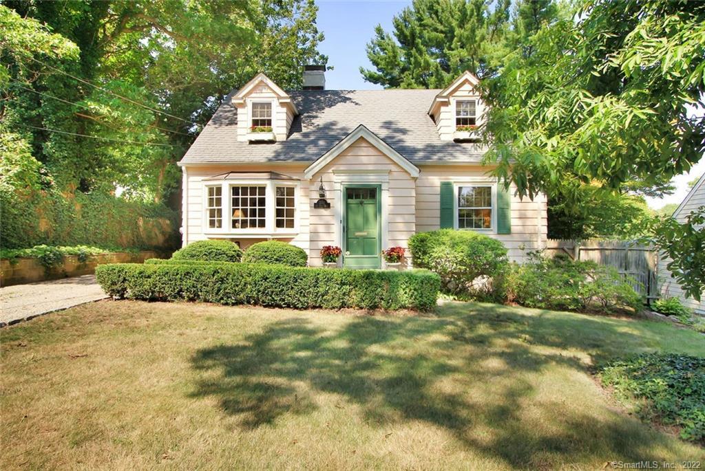 1138 Oldfield Road Fairfield, CT 06824 - Photo 1 of 1 a front view of a house with a yard