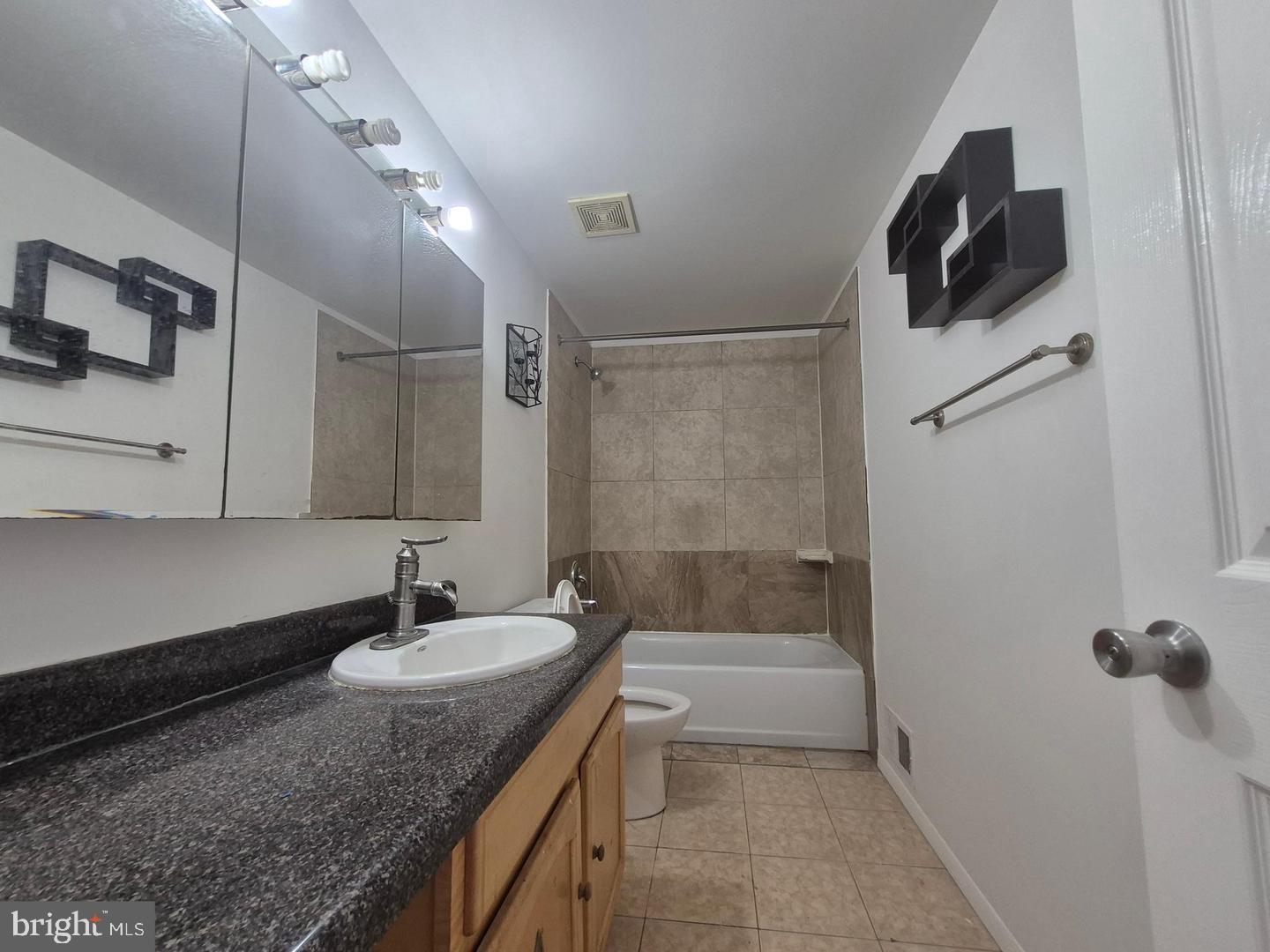 9323 Matador Road Columbia, MD 21045 - Photo 9 of 22 Modern bathroom with sleek finishes.