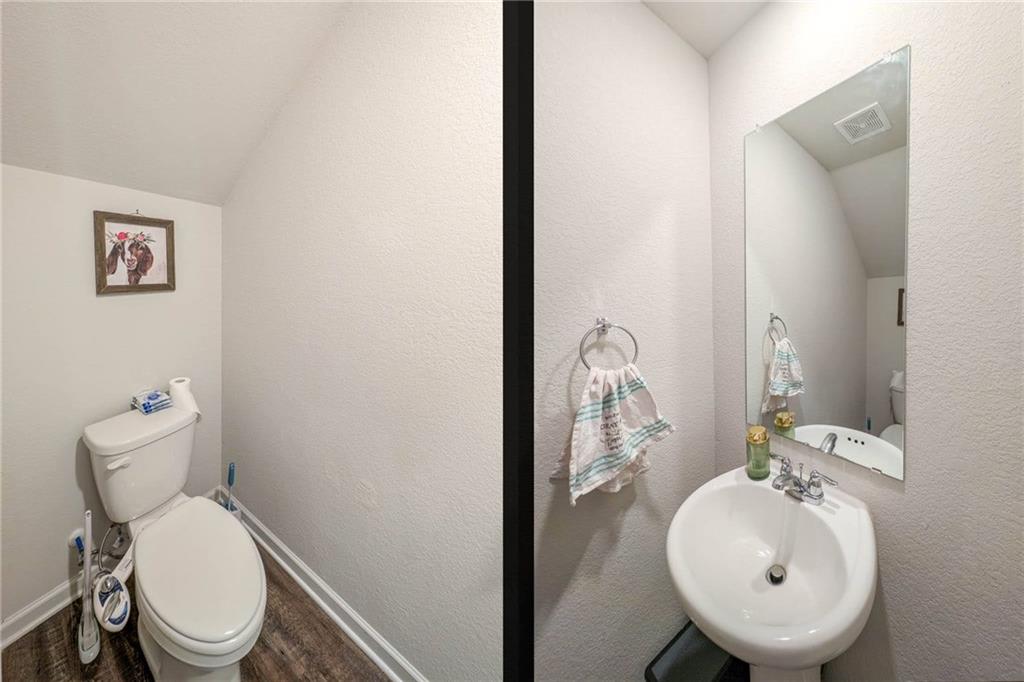 635 Meadows Farm Way Monroe, GA 30655 - Photo 18 of 36 a bathroom with a toilet sink and mirror
