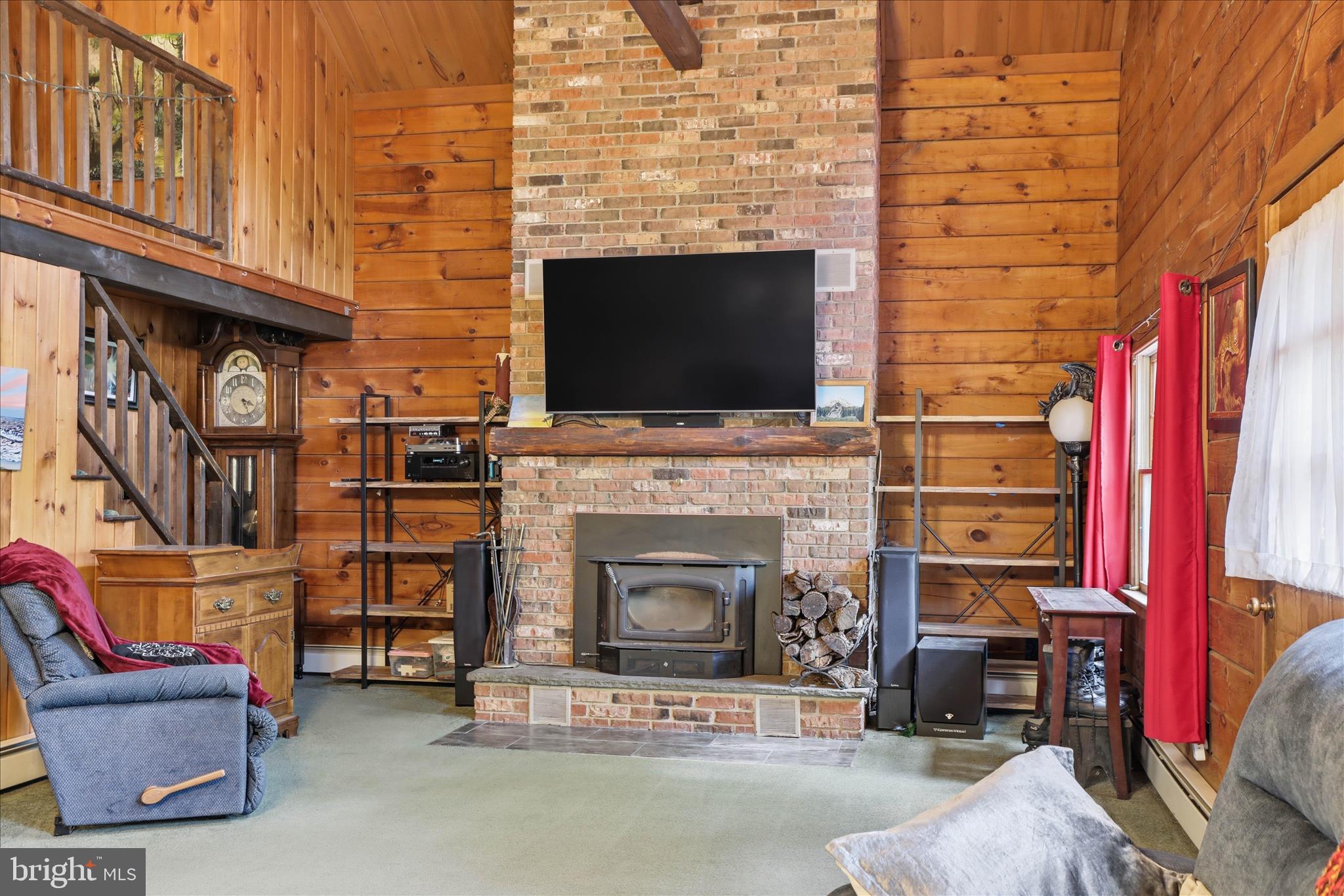 20 Star Lite Drive Lititz, PA 17543 - Photo 9 of 59 a living room with furniture a flat screen tv and a fireplace