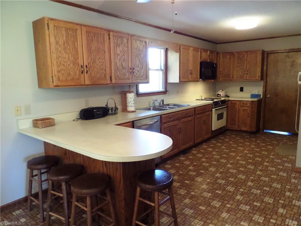 3308 Doub Road East Bend, NC 27018 - Photo 12 of 27 Microwave and dishwasher are just a few years old. Great cabinet space and there are 2 lazy Susan's for added storage.