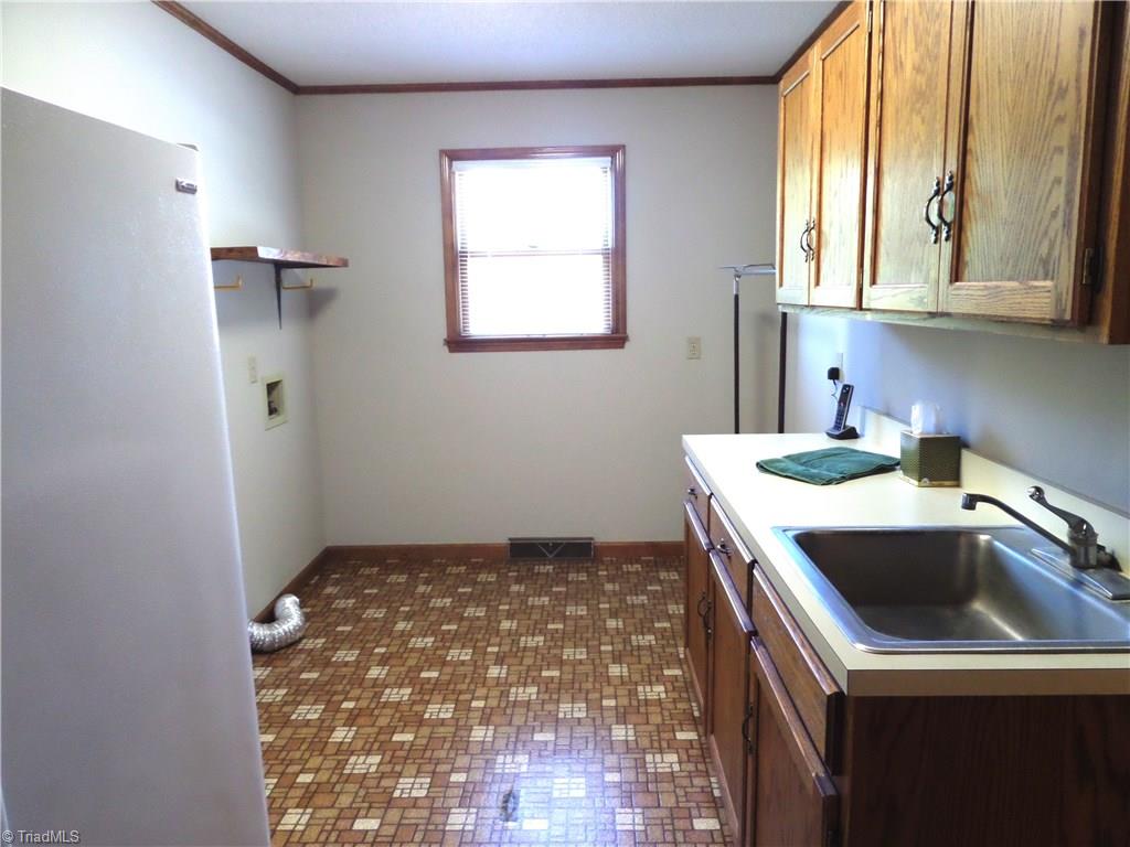 3308 Doub Road East Bend, NC 27018 - Photo 16 of 27 Another view of the large laundry room....great space and many possibilities for it's use.