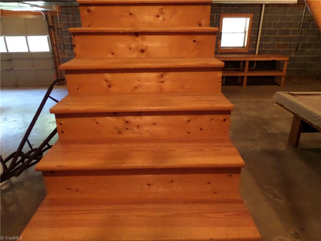 3308 Doub Road East Bend, NC 27018 - Photo 21 of 27 Wood stairs to the lower level.