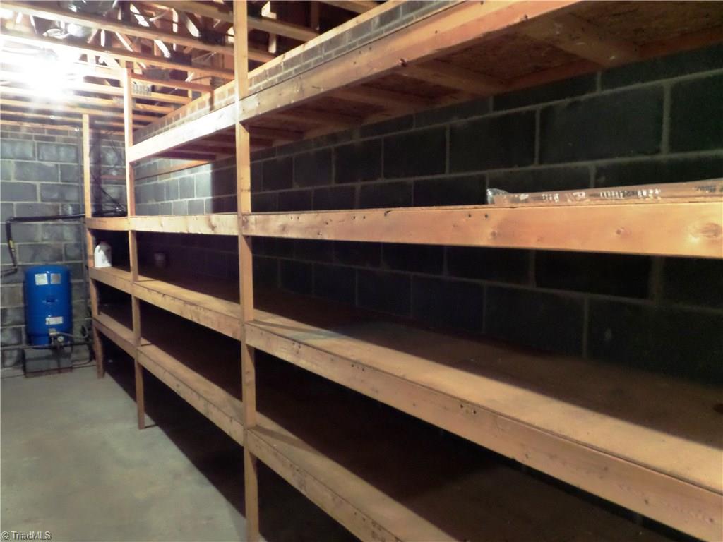 3308 Doub Road East Bend, NC 27018 - Photo 22 of 27 Fantastic shelving helps to keep storage organized.