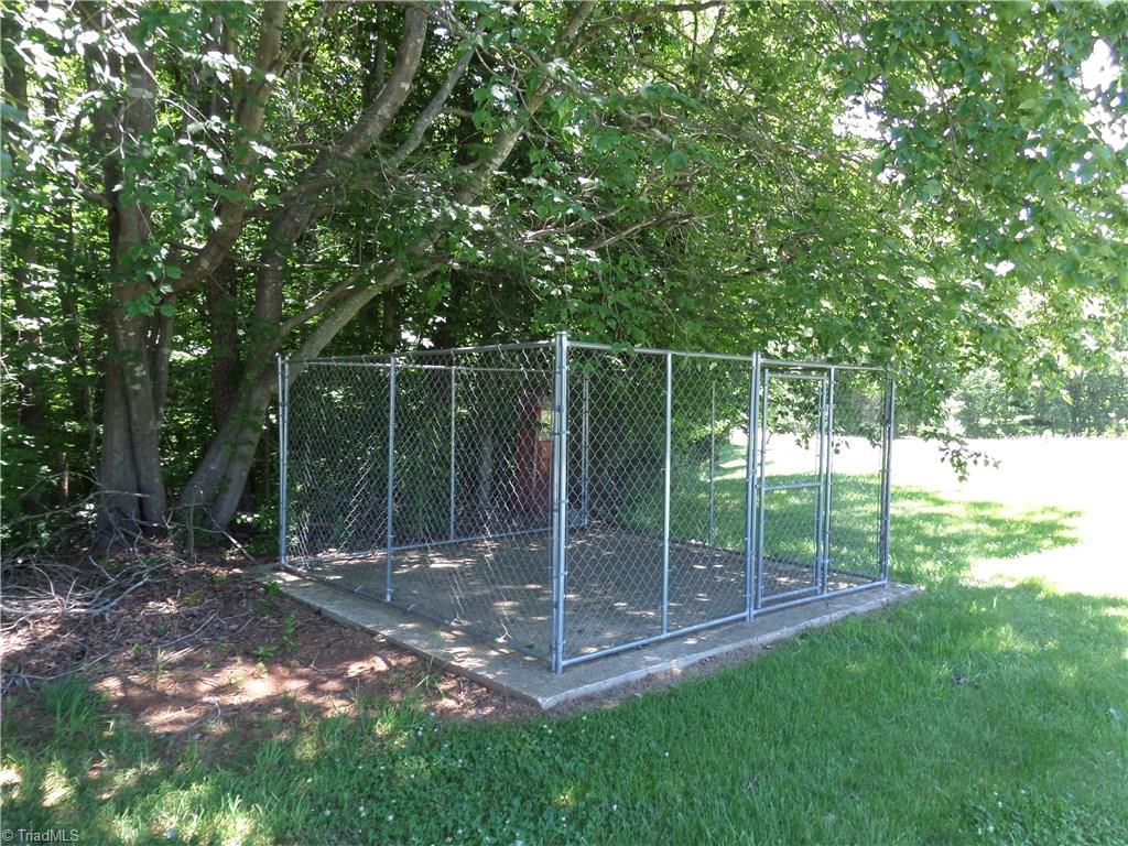 3308 Doub Road East Bend, NC 27018 - Photo 25 of 27 Dog pen in a nice shaded area.
