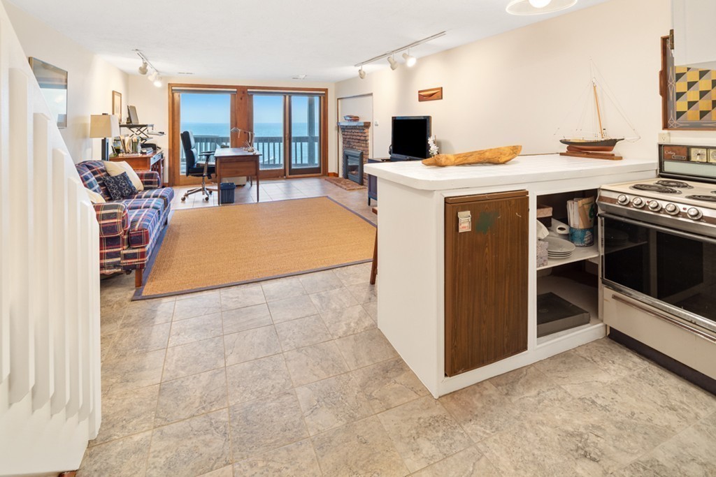 13 Oceanside Drive, Unit 13 Hull, MA 02045 - Photo 17 of 27 a view of a kitchen with furniture and a stove