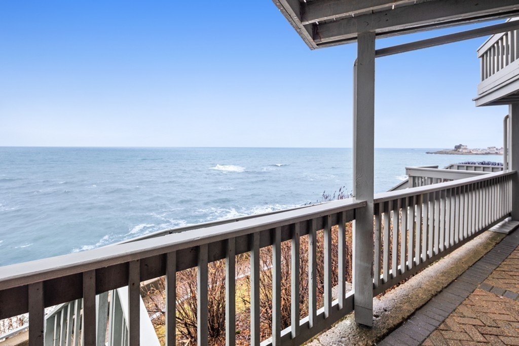13 Oceanside Drive, Unit 13 Hull, MA 02045 - Photo 19 of 27 a view of a balcony next to a yard
