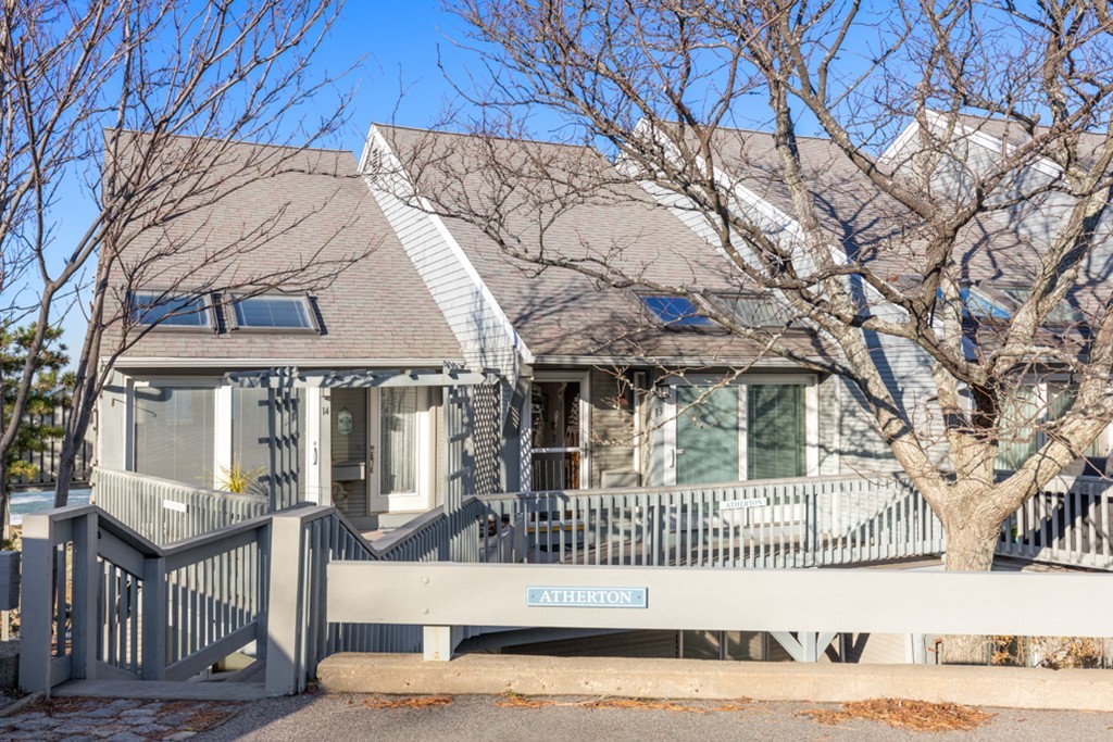 13 Oceanside Drive, Unit 13 Hull, MA 02045 - Photo 21 of 27 a front view of a house with a yard