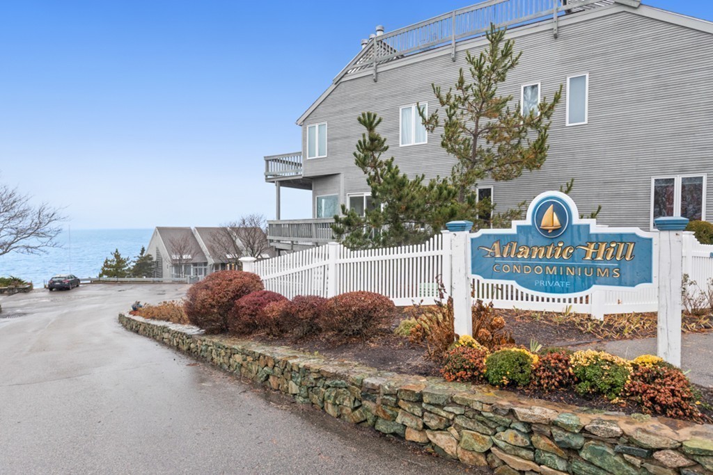 13 Oceanside Drive, Unit 13 Hull, MA 02045 - Photo 24 of 27 a view of a street with houses