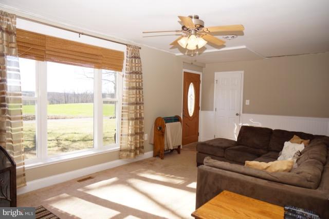 11019 Keymar Road Woodsboro, MD 21798 - Photo 2 of 30 a living room with furniture and a large window