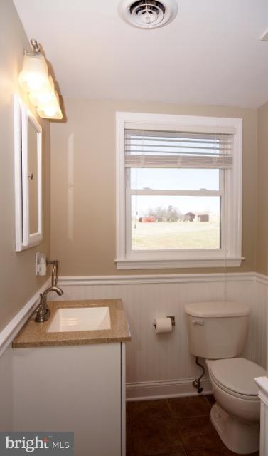 11019 Keymar Road Woodsboro, MD 21798 - Photo 13 of 30 a bathroom with a granite countertop sink toilet and a mirror