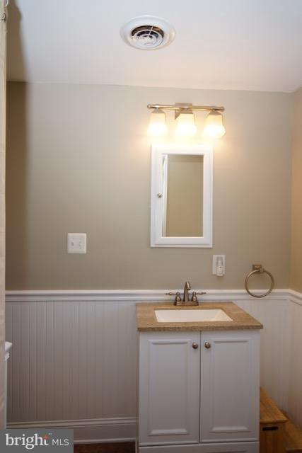 11019 Keymar Road Woodsboro, MD 21798 - Photo 14 of 30 a bathroom with a sink vanity and mirror