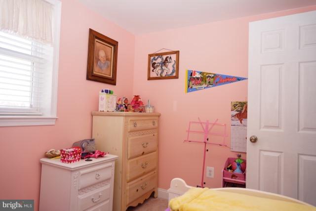 11019 Keymar Road Woodsboro, MD 21798 - Photo 18 of 30 a bedroom with a bed and a dresser in it