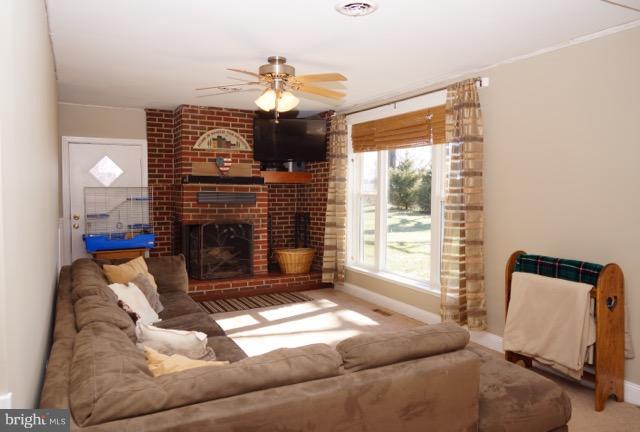 11019 Keymar Road Woodsboro, MD 21798 - Photo 4 of 30 a living room with furniture and a fireplace
