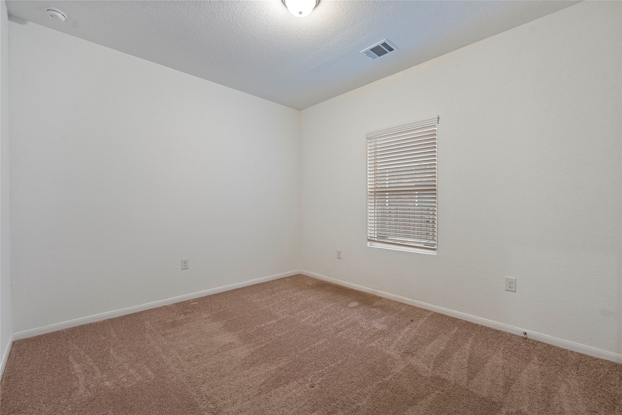 149 Biscayne Drive Kyle, TX 78640 - Photo 13 of 20 an empty room with a window