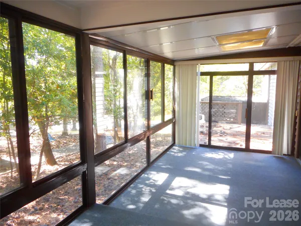 a view of an empty room with a large window