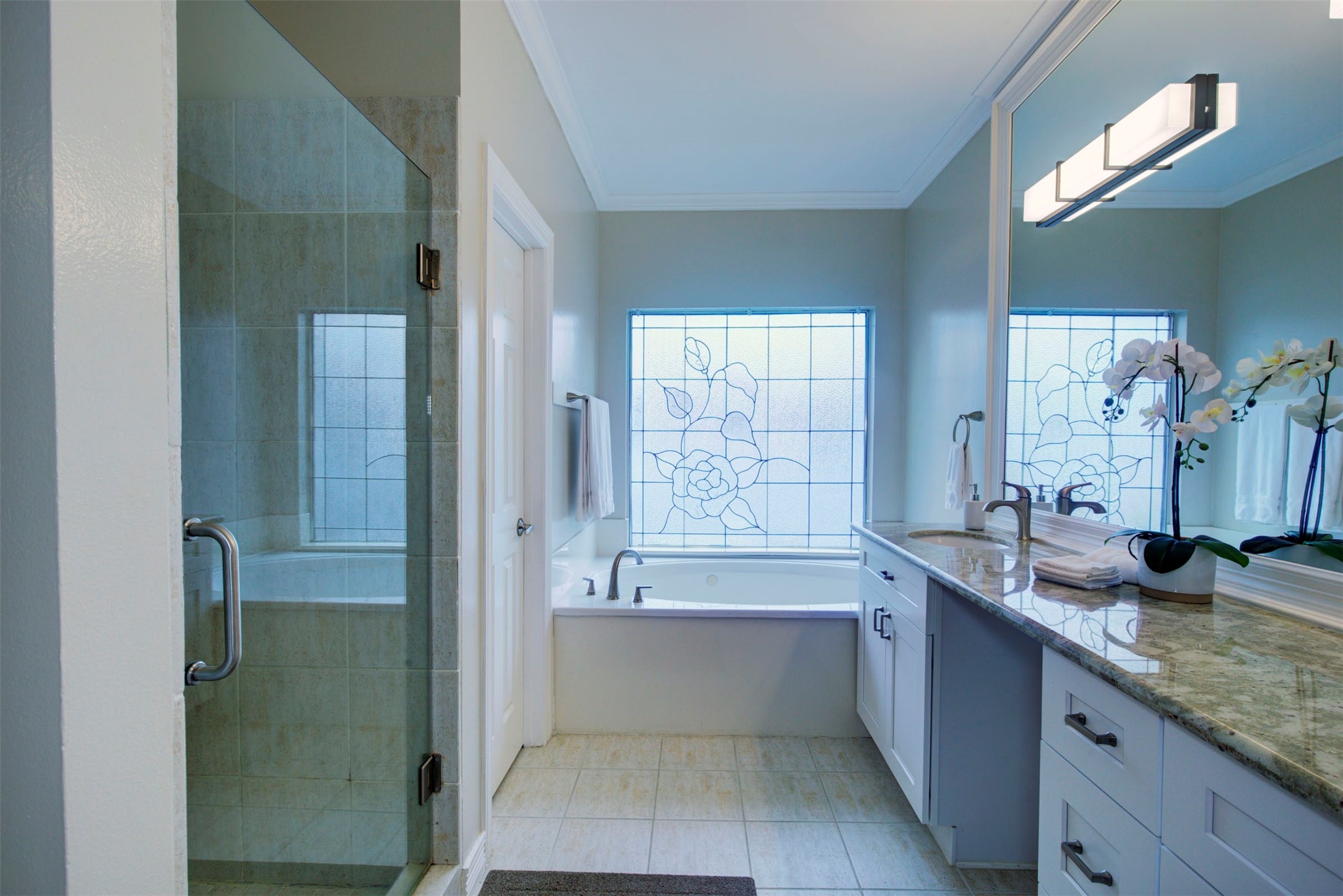 1711 Huldy Street, Unit A Houston, TX 77019 - Photo 16 of 38 a bathroom with a granite countertop tub sink and mirror