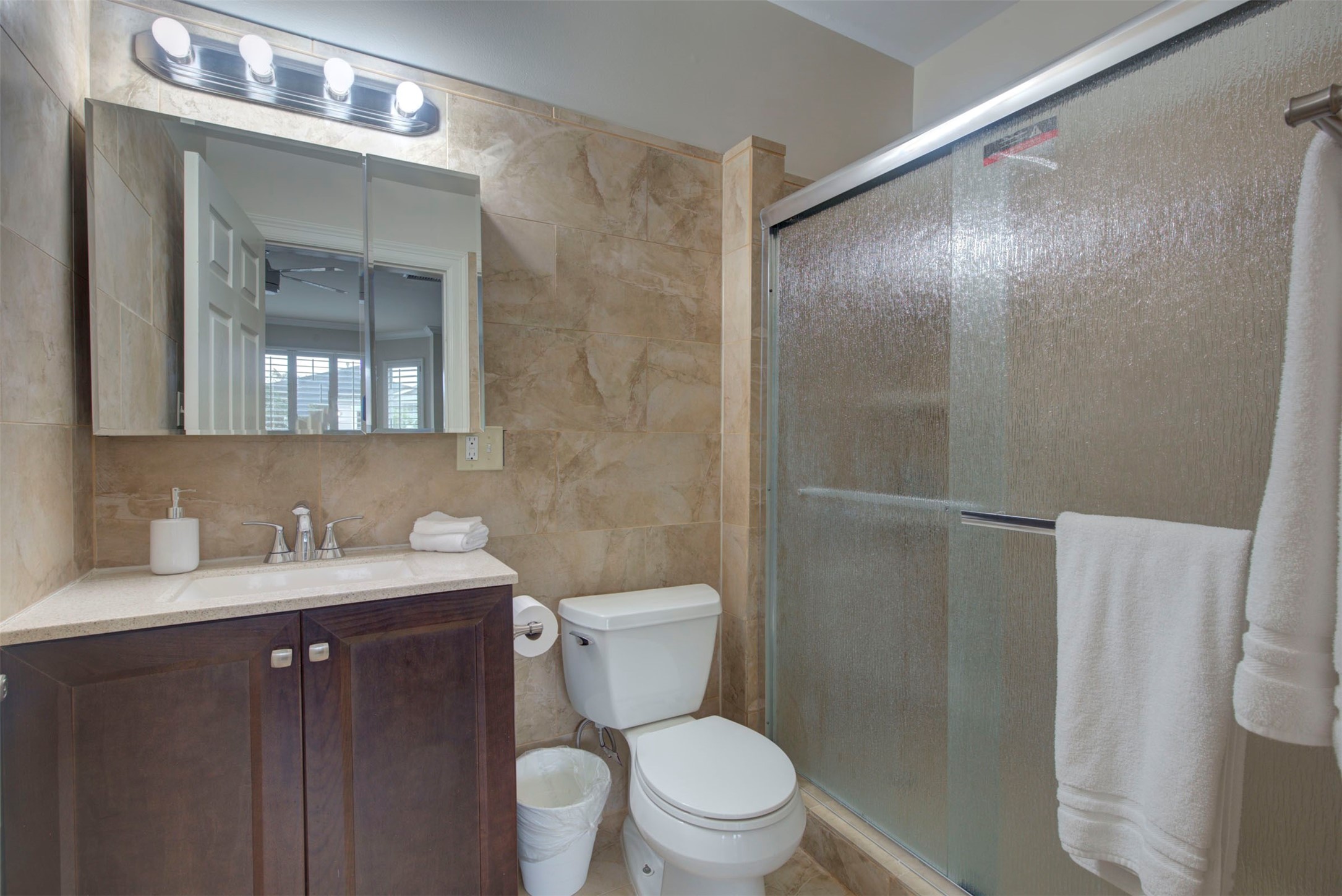 1711 Huldy Street, Unit A Houston, TX 77019 - Photo 20 of 38 a bathroom with a toilet sink vanity and mirror