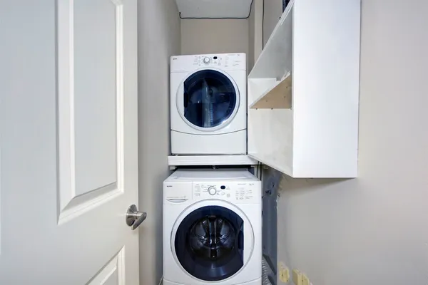 a view of a hallway with washer and dryer
