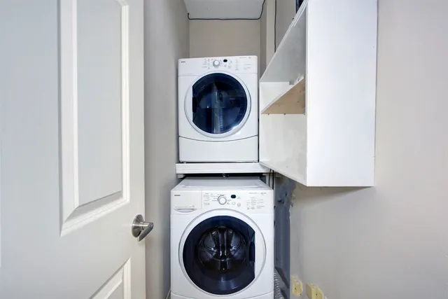 a bathroom with a granite countertop sink a toilet and a large mirror