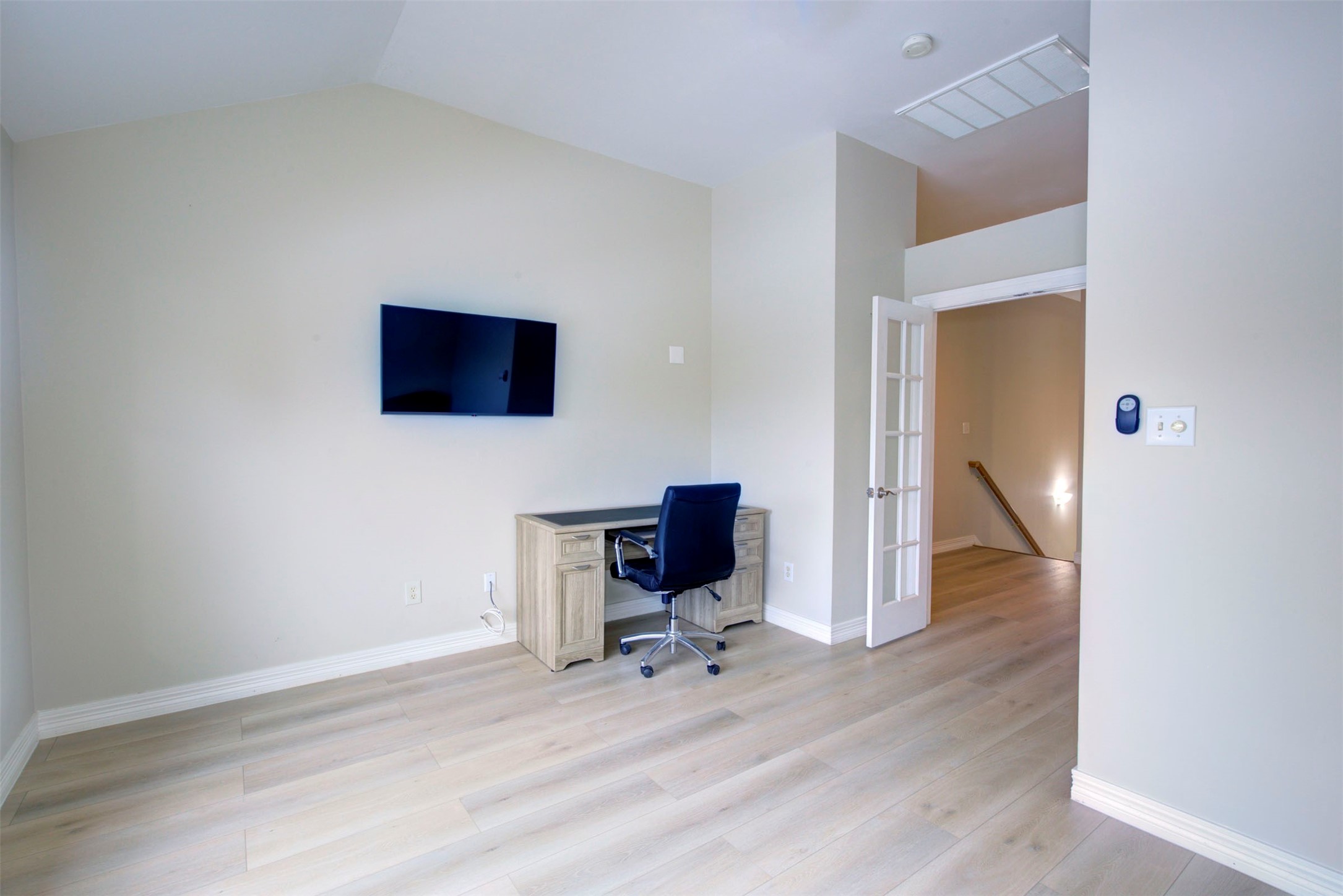 1711 Huldy Street, Unit A Houston, TX 77019 - Photo 24 of 38 a view of a workspace with wooden floor and a workspace