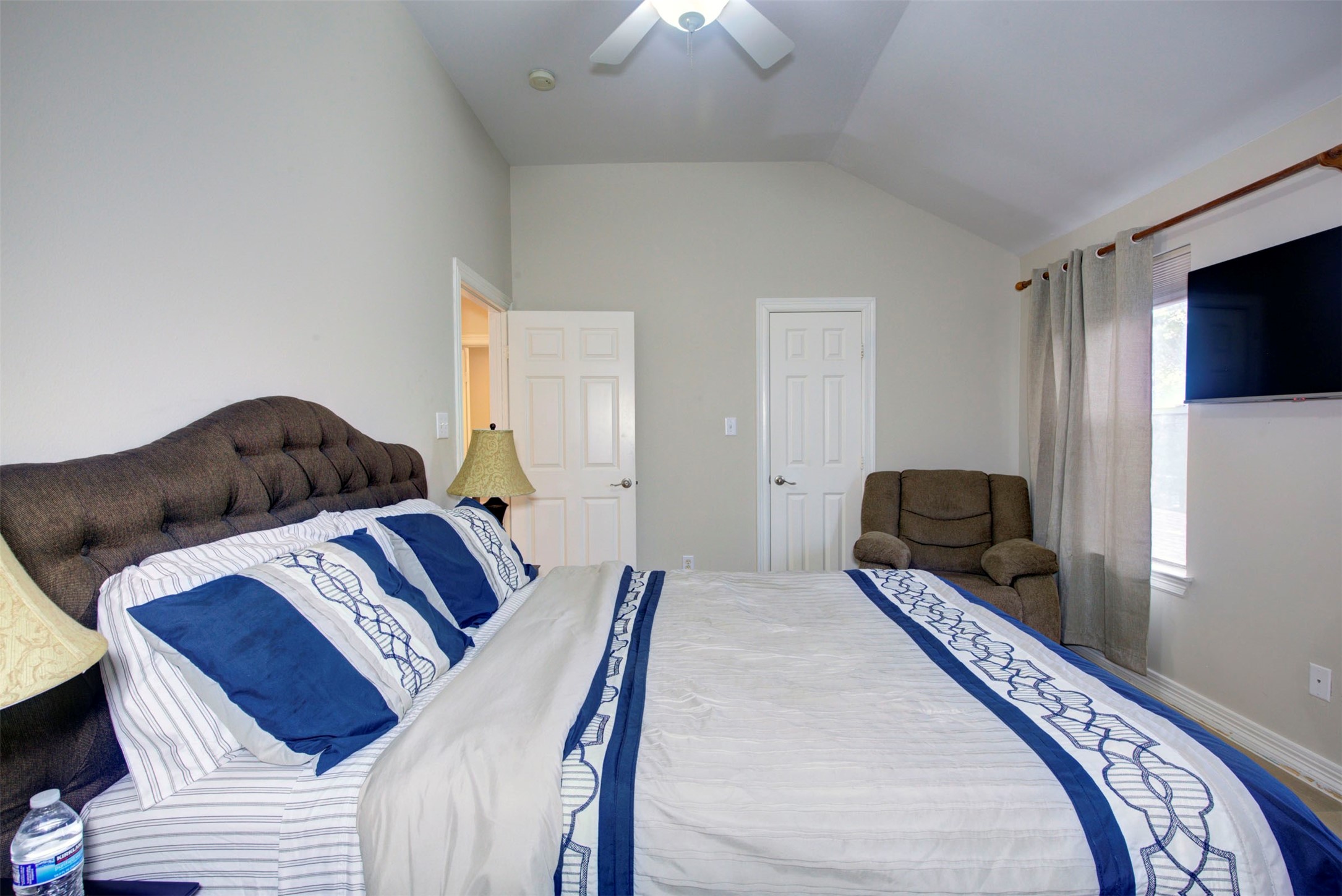 1711 Huldy Street, Unit A Houston, TX 77019 - Photo 26 of 38 a bedroom with a bed and wooden floor