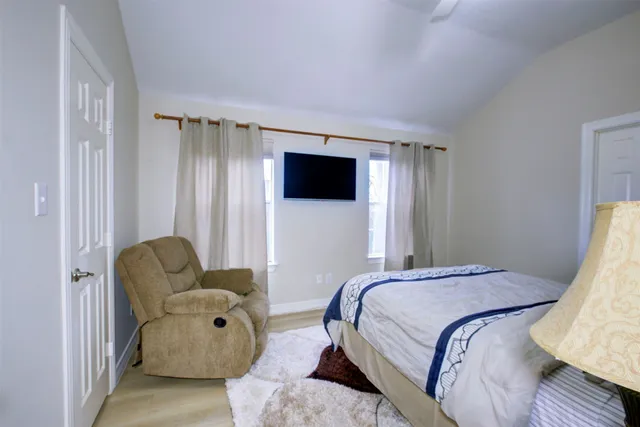 a living room with furniture and a rug