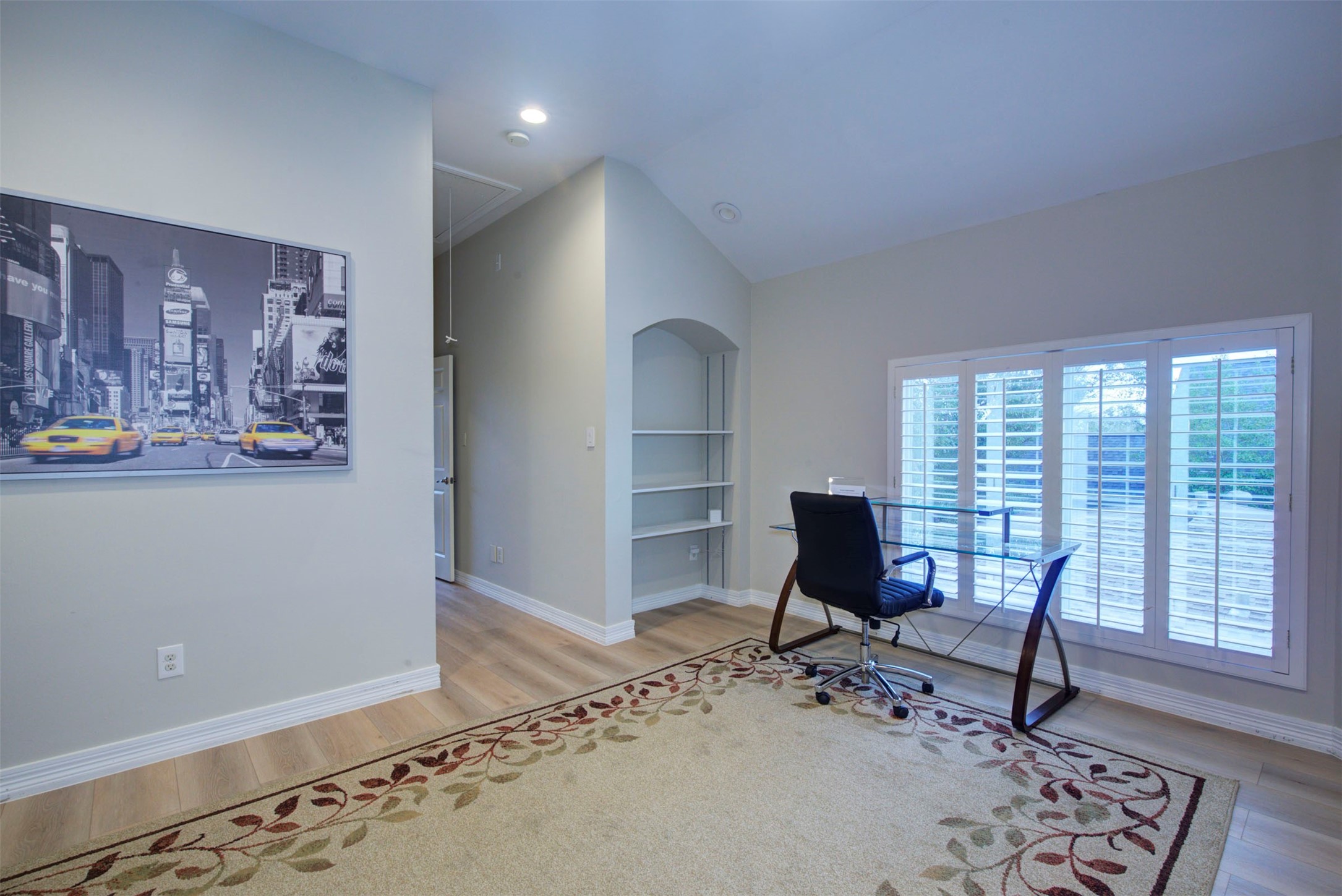 1711 Huldy Street, Unit A Houston, TX 77019 - Photo 37 of 38 a view of a workspace with furniture and a window
