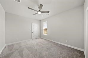 31302 Quartet Court Fulshear, TX 77441 - Photo 21 of 32 an empty room with a window and a fan