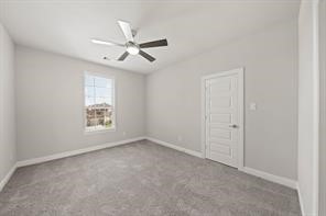 31302 Quartet Court Fulshear, TX 77441 - Photo 23 of 32 an empty room with windows and fan