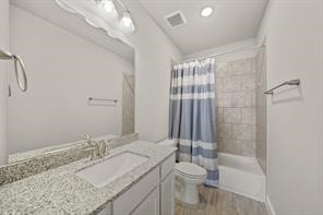 31302 Quartet Court Fulshear, TX 77441 - Photo 24 of 32 a bathroom with a granite countertop sink toilet and shower