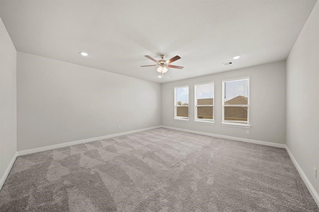 31302 Quartet Court Fulshear, TX 77441 - Photo 28 of 32 a view of an empty room with a window