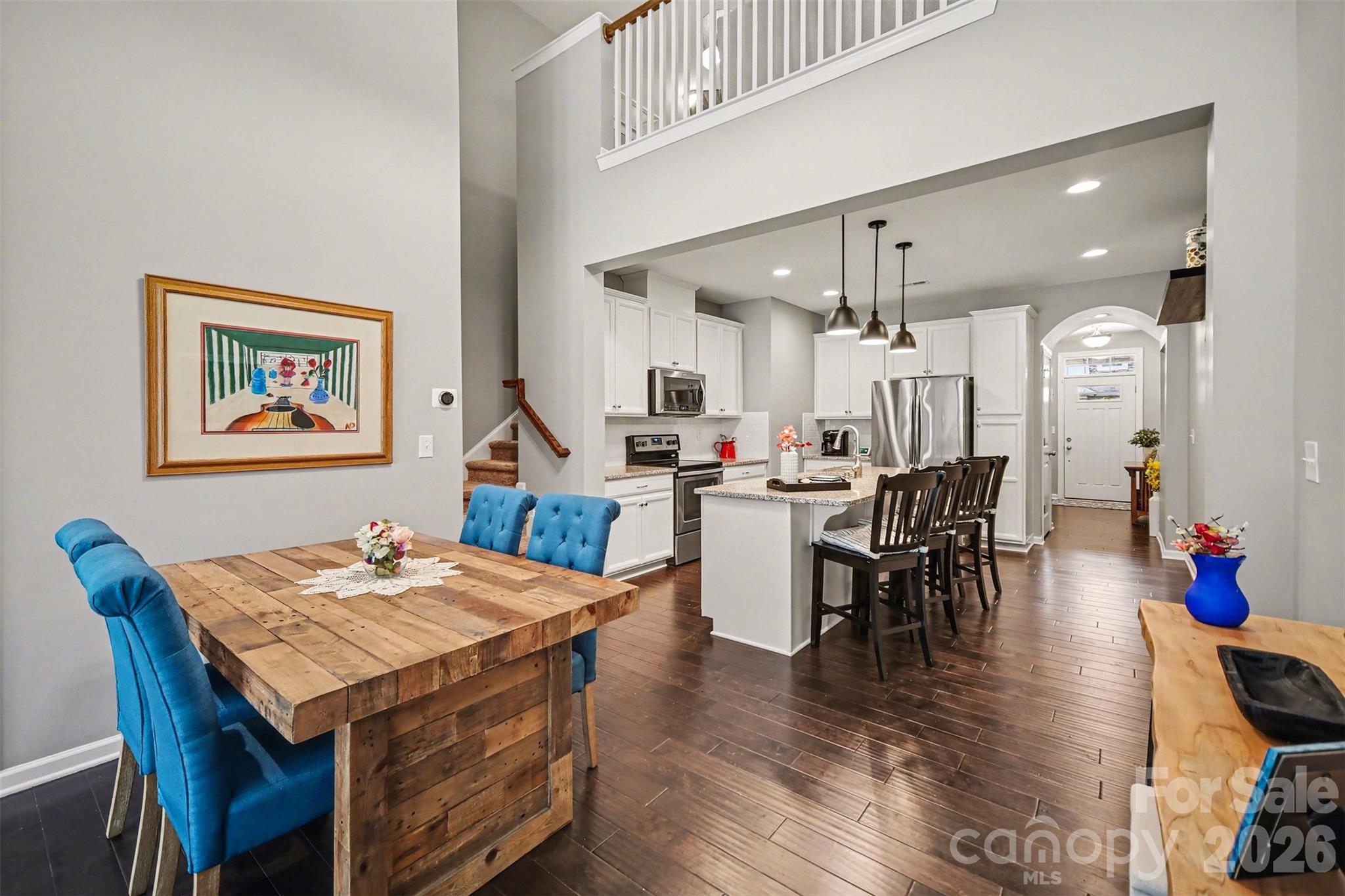 1008 Archibald Avenue Fort Mill, SC 29708 - Photo 3 of 43 a view of a dining room with furniture and wooden floor
