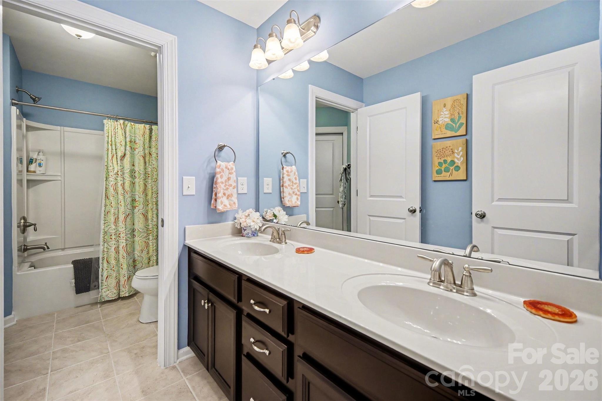 1008 Archibald Avenue Fort Mill, SC 29708 - Photo 10 of 43 a bathroom with a sink double vanity granite tub shower and a mirror