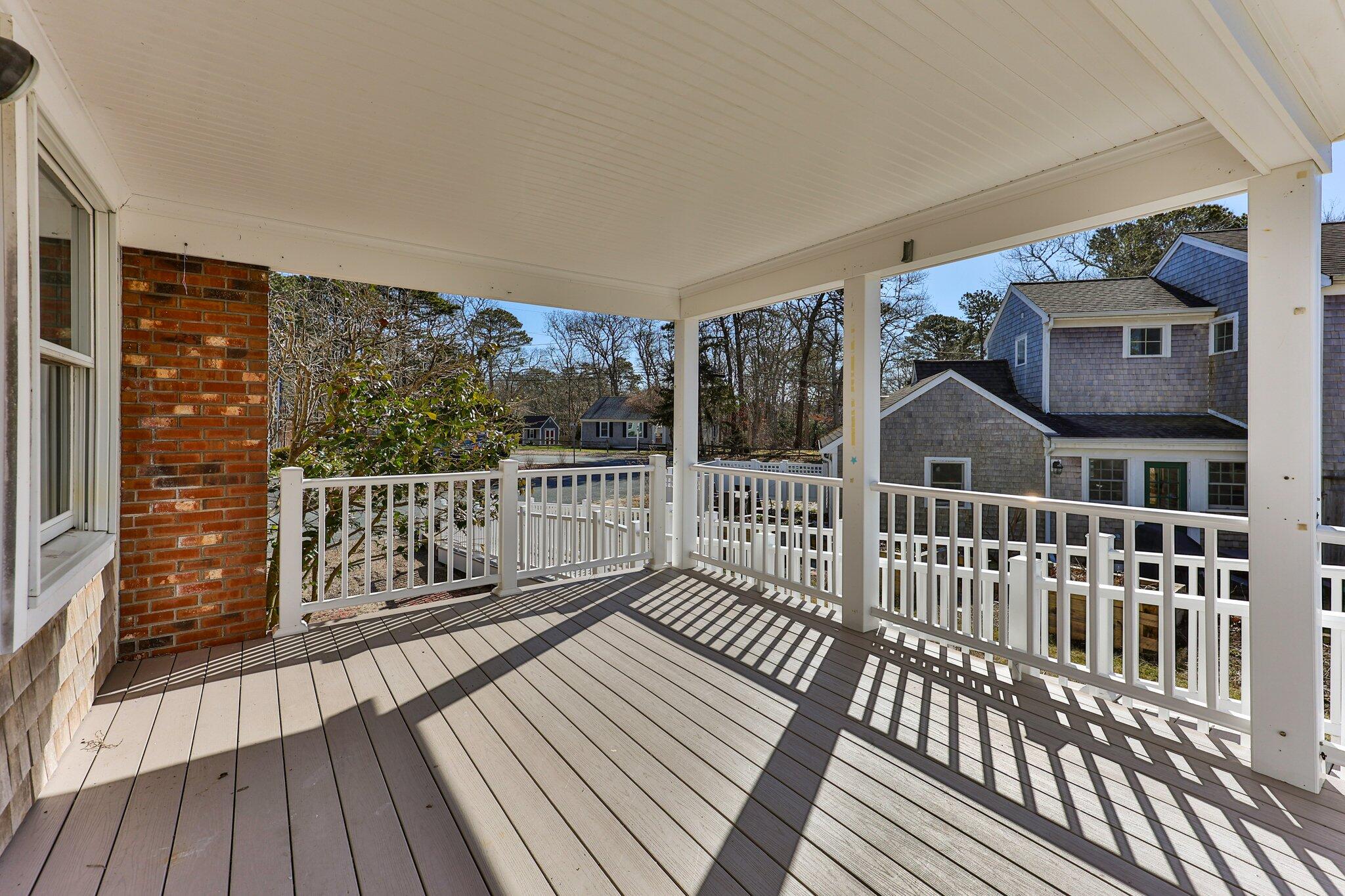 5 Signe Road Dennis, MA 02638 - Photo 14 of 39 a view of balcony with wooden floor