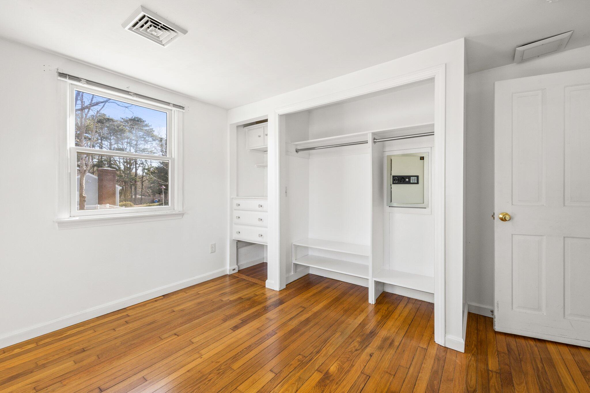 5 Signe Road Dennis, MA 02638 - Photo 18 of 39 a view of empty room with wooden floor and window