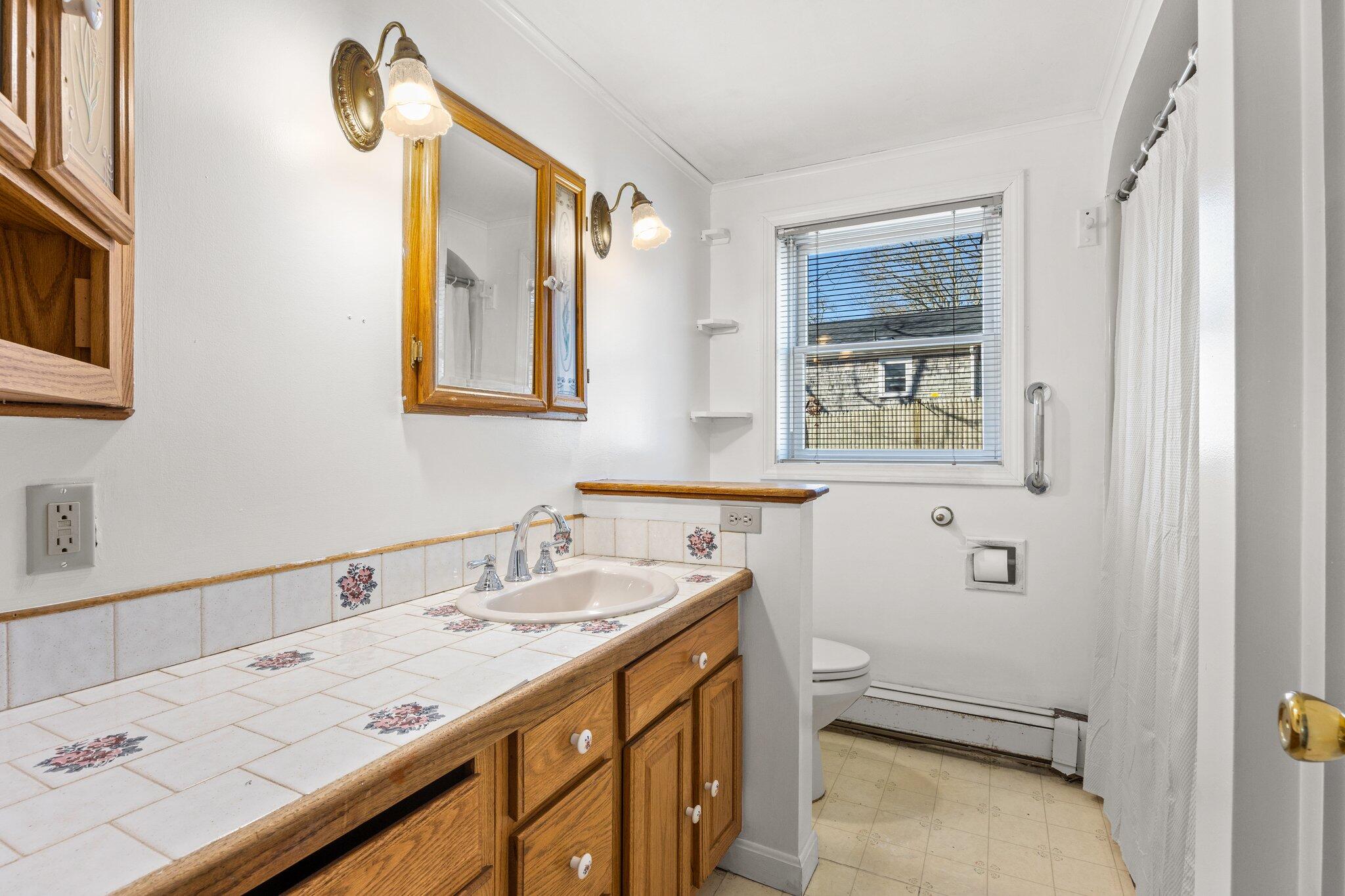 5 Signe Road Dennis, MA 02638 - Photo 20 of 39 a bathroom with a sink a toilet and shower