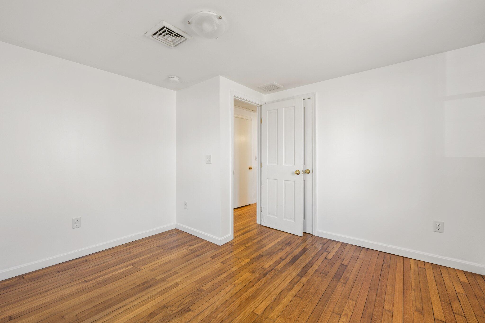 5 Signe Road Dennis, MA 02638 - Photo 22 of 39 a view of an empty room with wooden floor