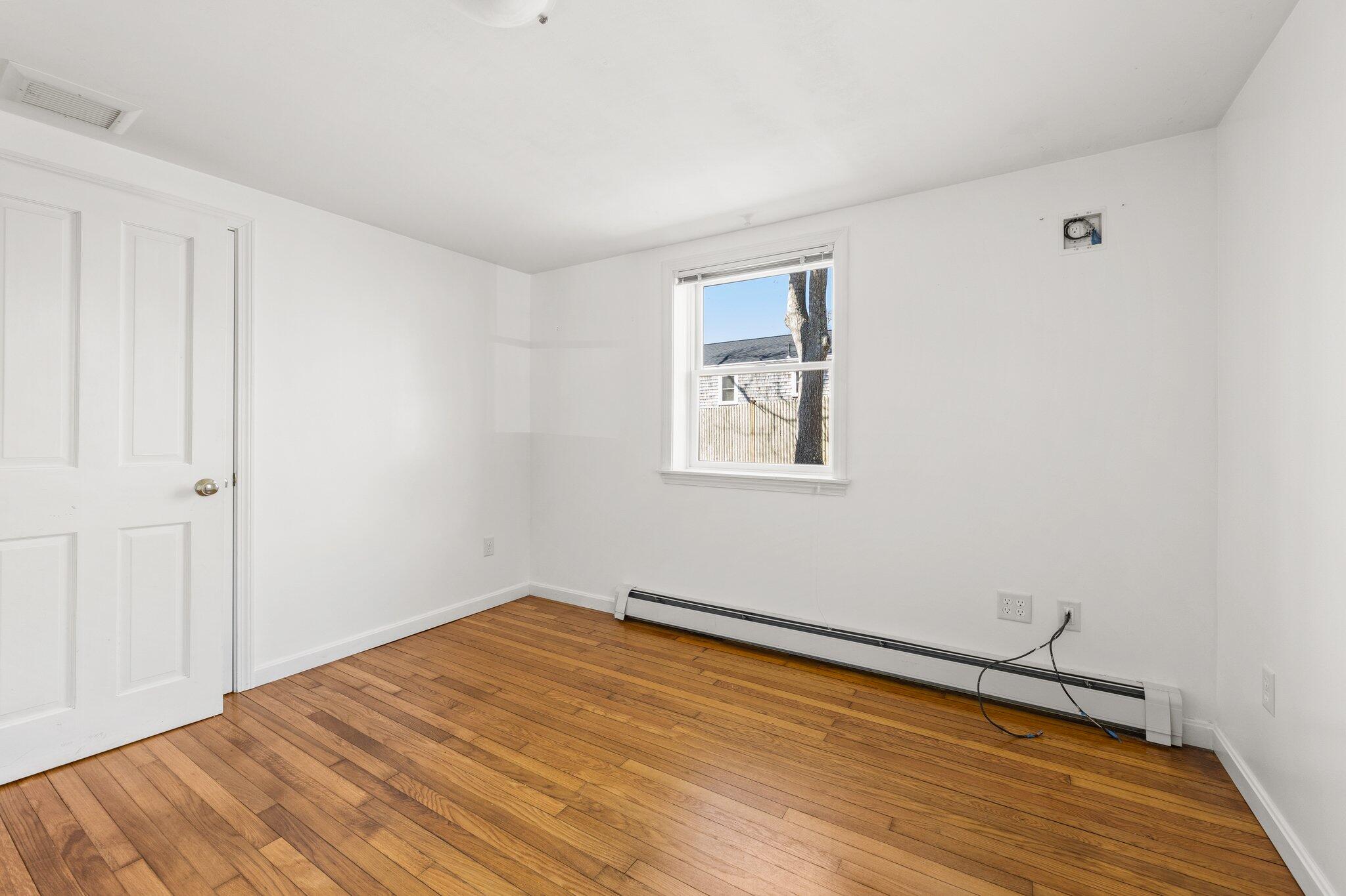 5 Signe Road Dennis, MA 02638 - Photo 23 of 39 a view of empty room with wooden floor