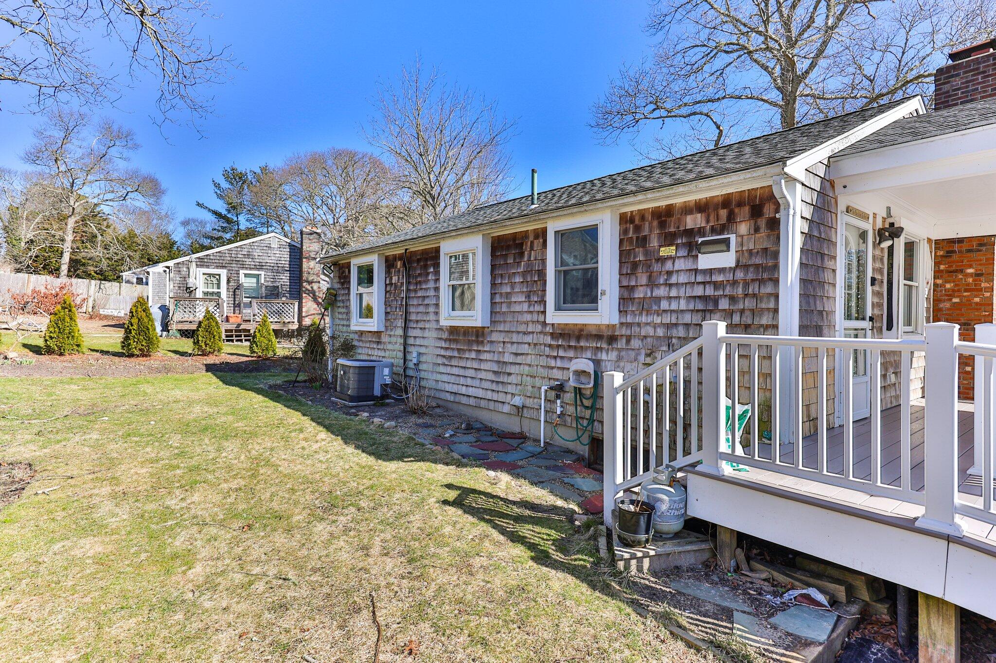 5 Signe Road Dennis, MA 02638 - Photo 30 of 39 a view of a house with a wooden fence