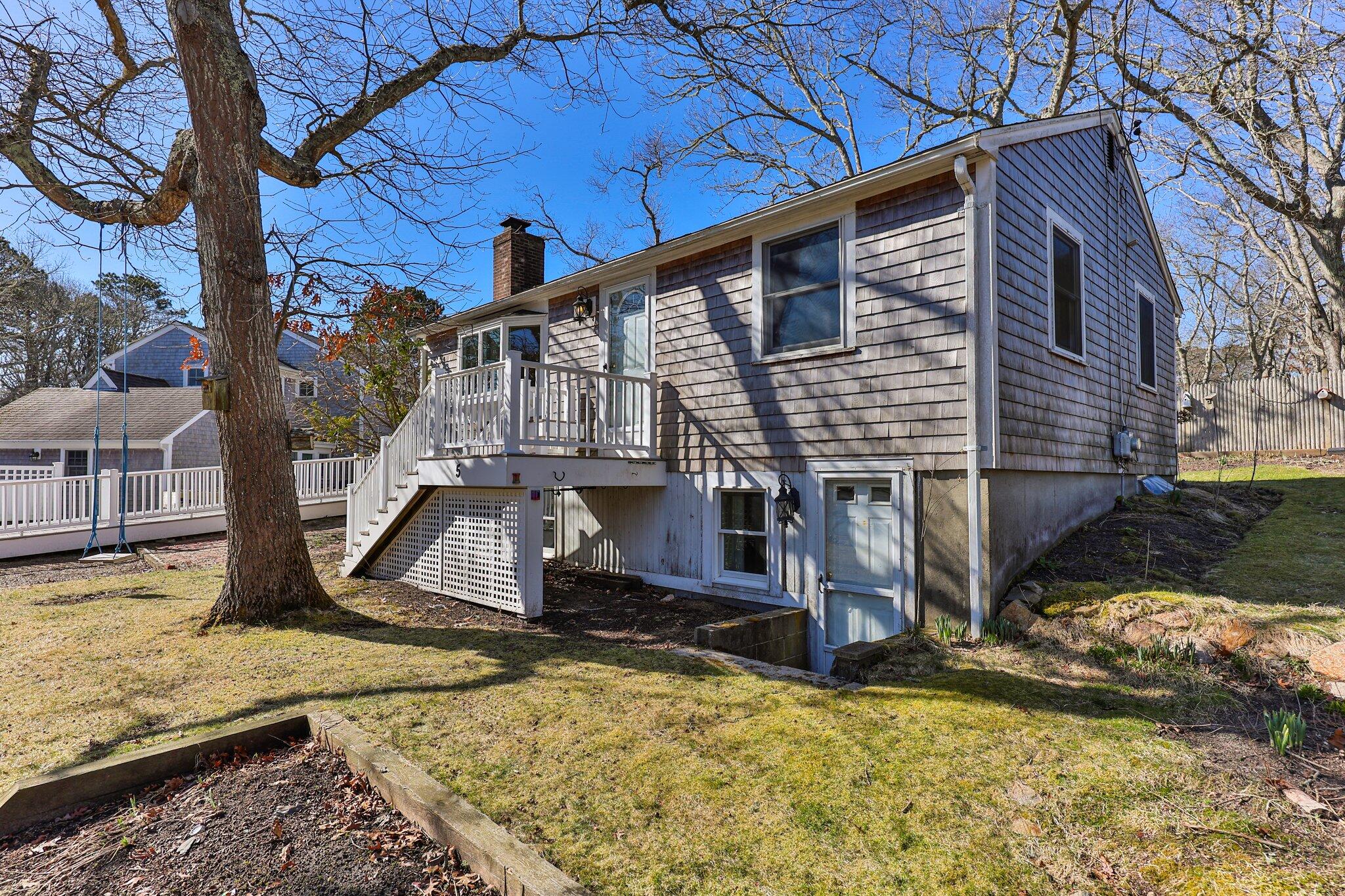 5 Signe Road Dennis, MA 02638 - Photo 3 of 39 a view of a house with snow on the wall