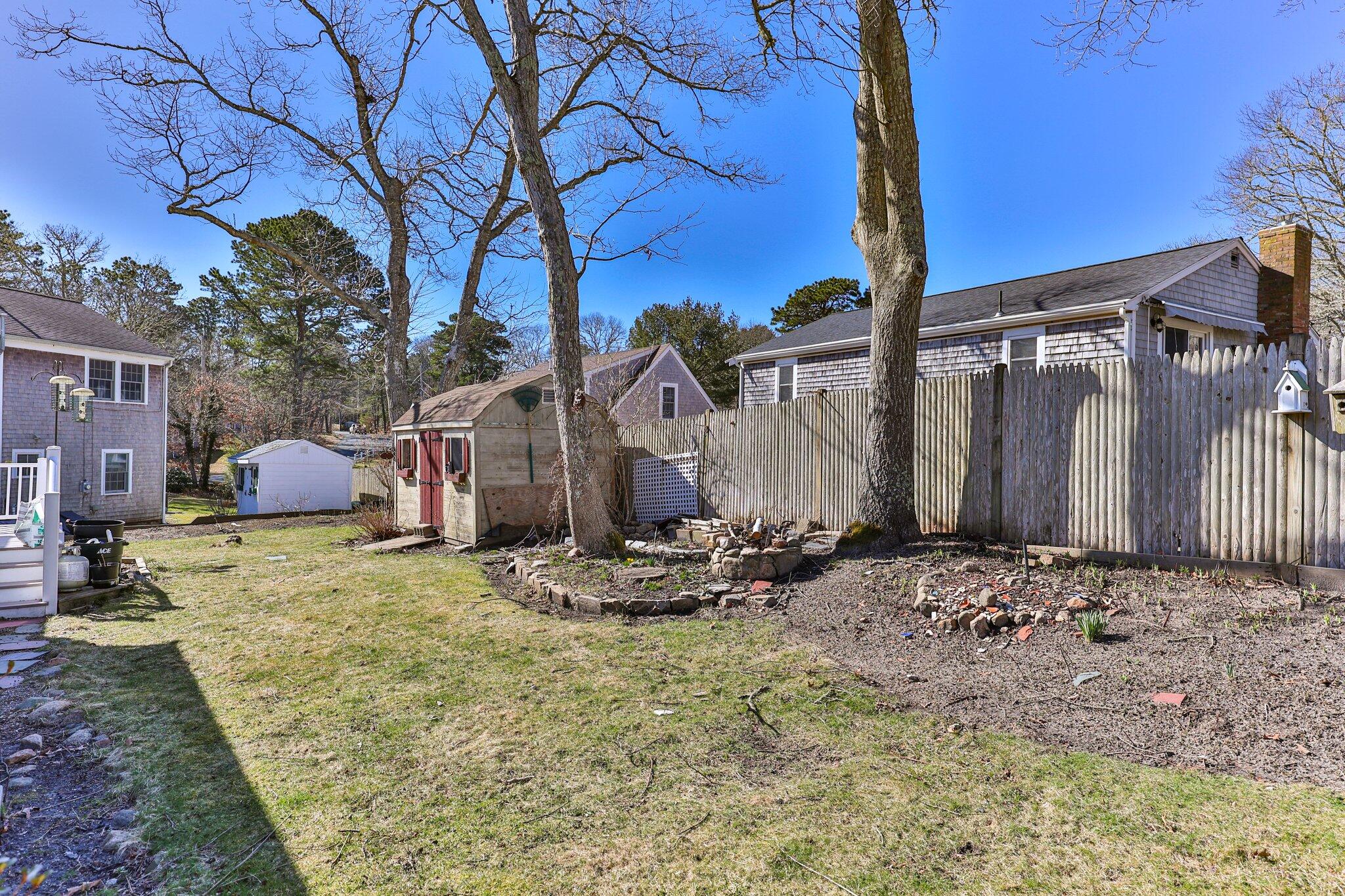 5 Signe Road Dennis, MA 02638 - Photo 31 of 39 a backyard of a house
