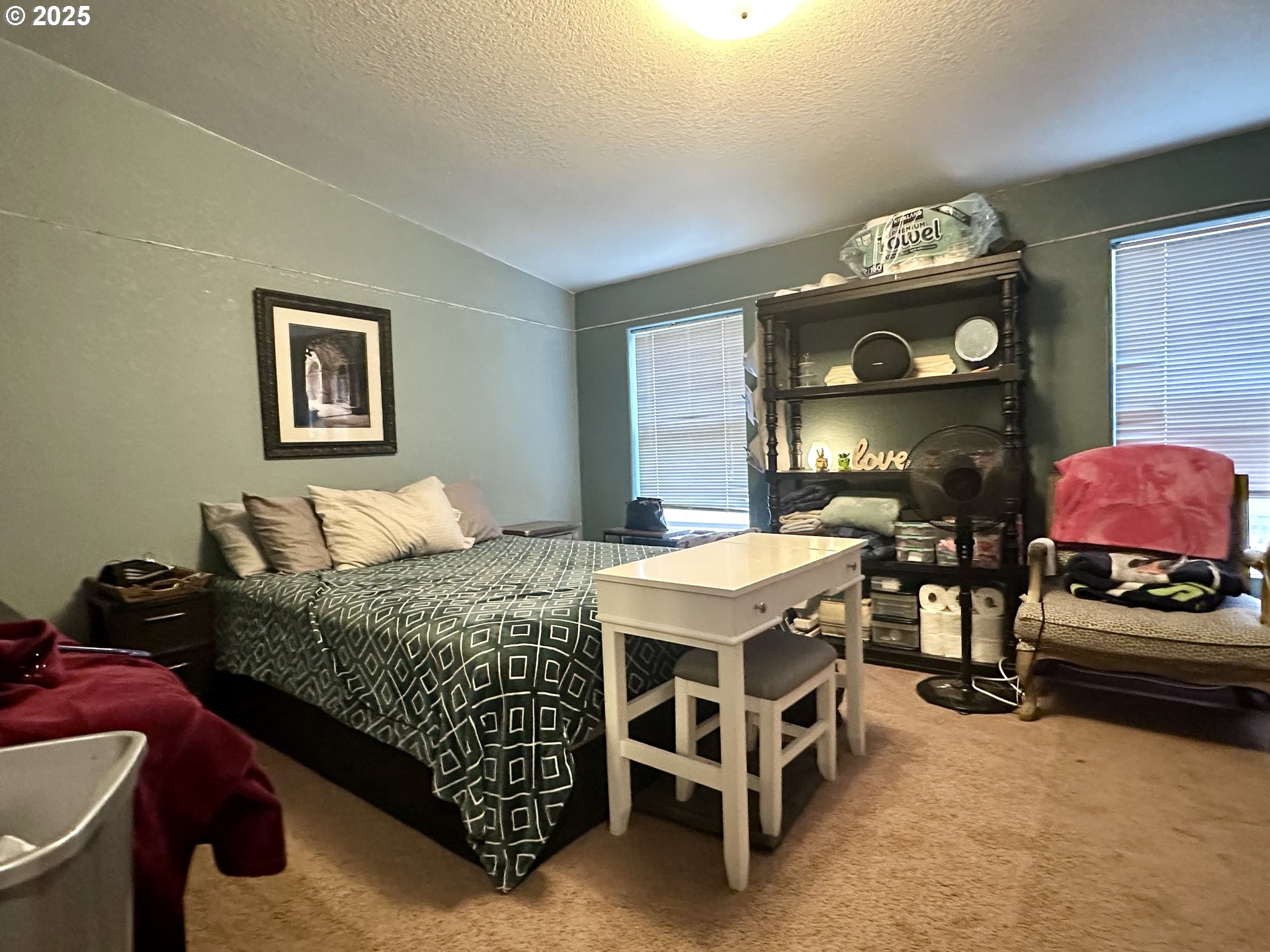 5510 E Street Springfield, OR 97478 - Photo 14 of 21 a bedroom with a bed and a mirror on dresser