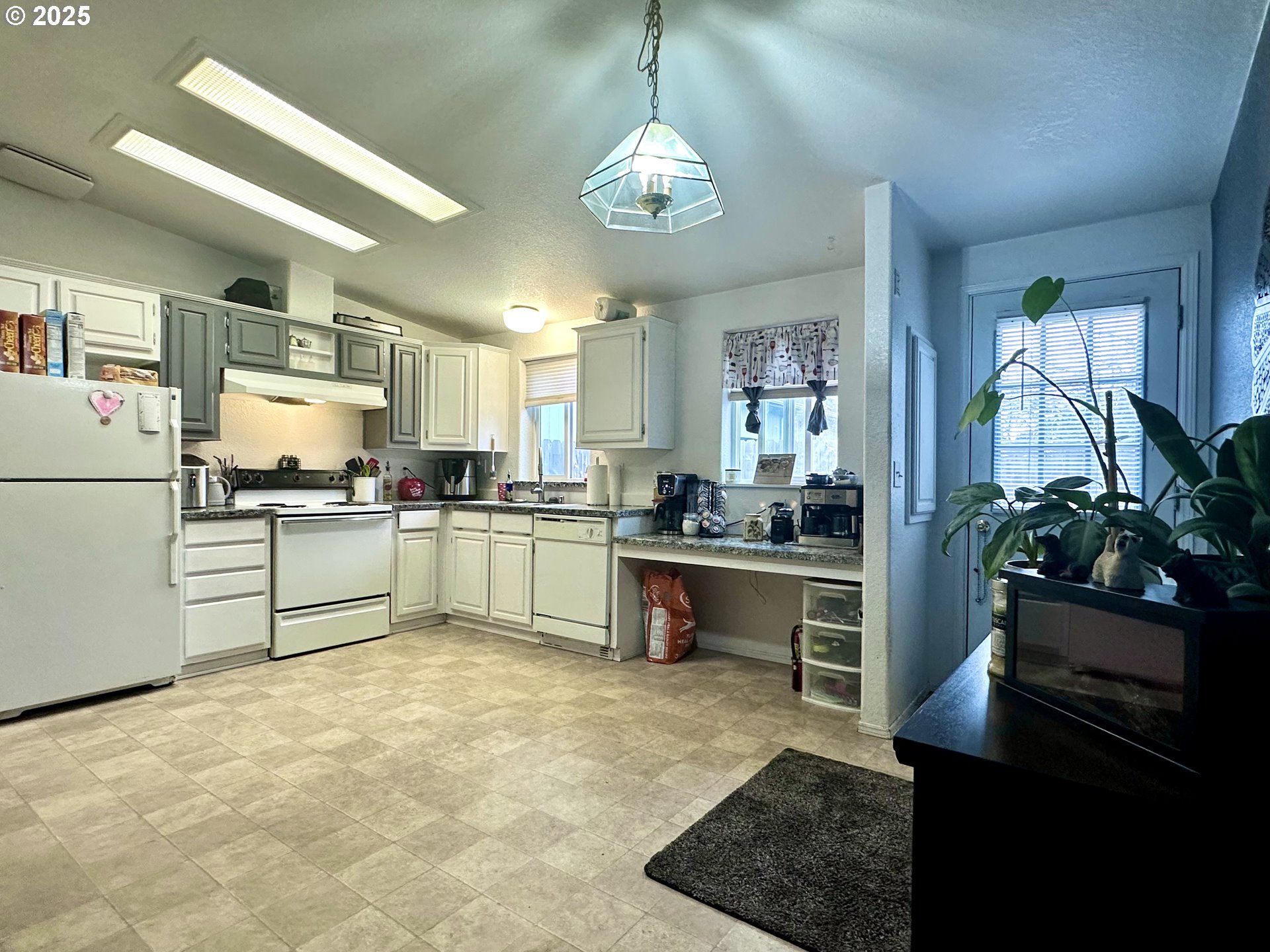 5510 E Street Springfield, OR 97478 - Photo 5 of 21 a kitchen with kitchen island a counter top space appliances and cabinets
