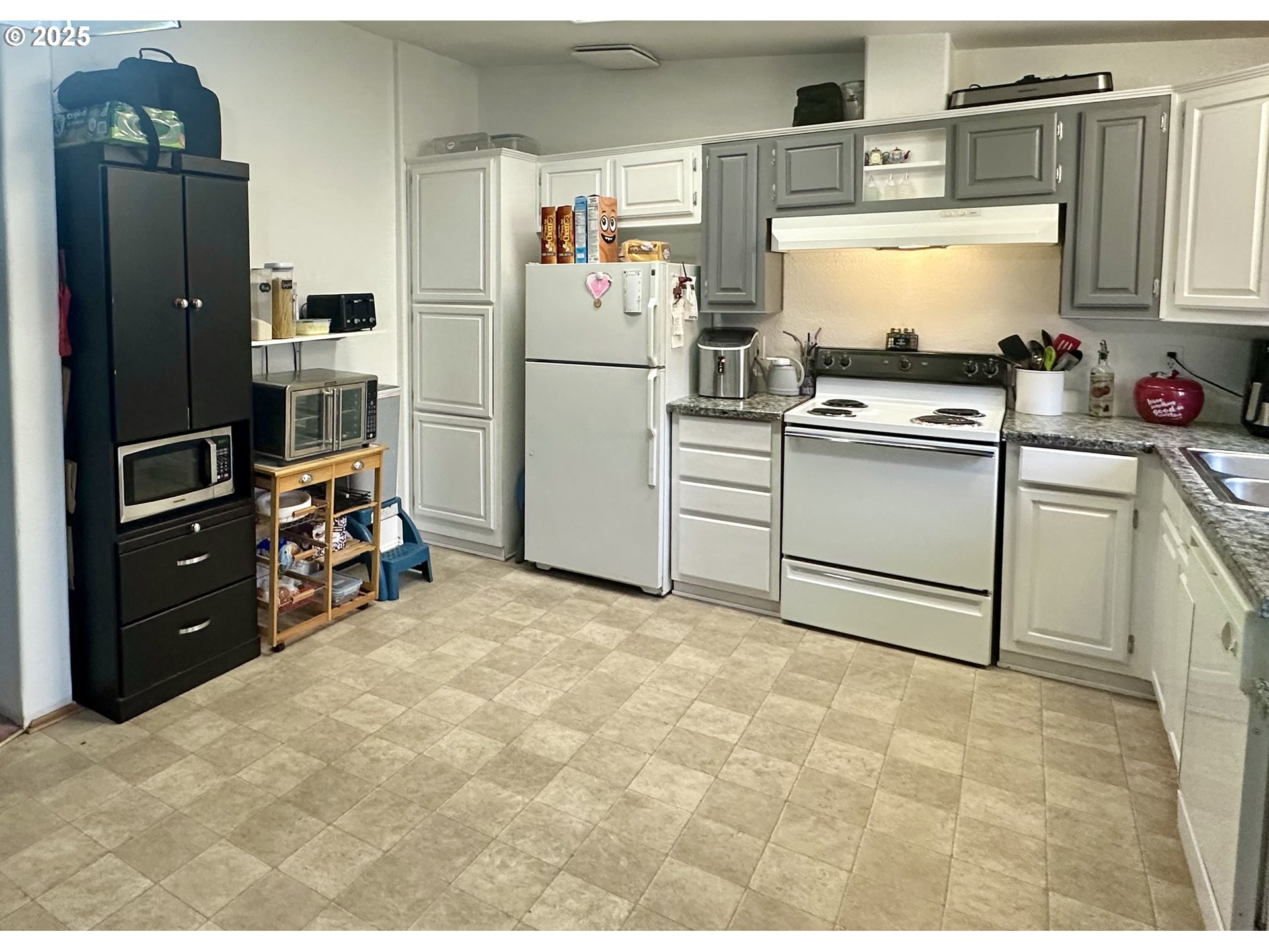 5510 E Street Springfield, OR 97478 - Photo 6 of 21 a kitchen with refrigerator and cabinets