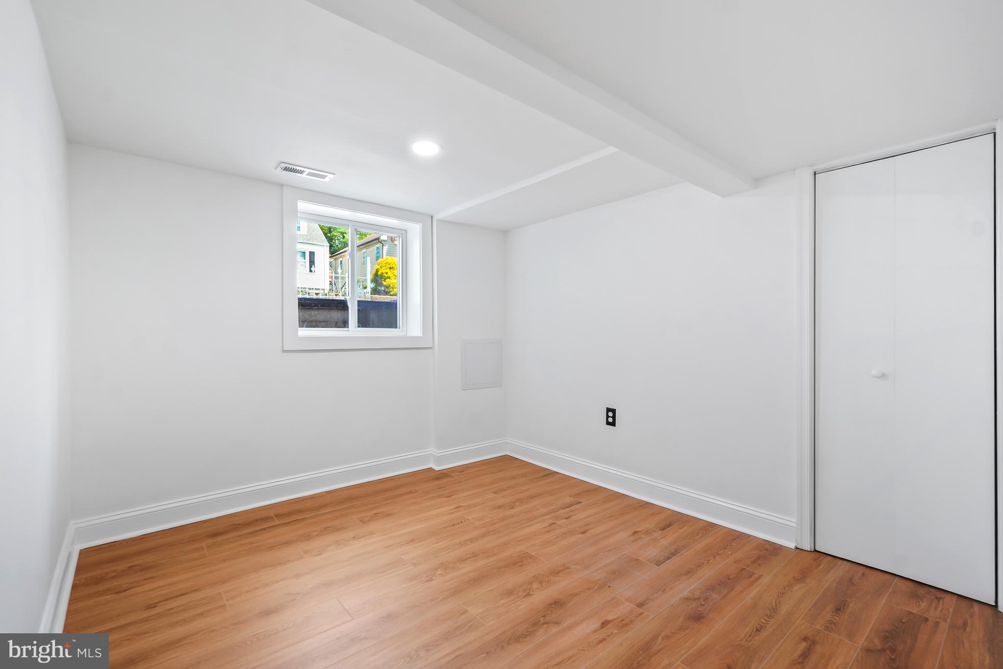5309 Chesapeake Road Hyattsville, MD 20781 - Photo 26 of 36 a view of empty room with wooden floor and fan