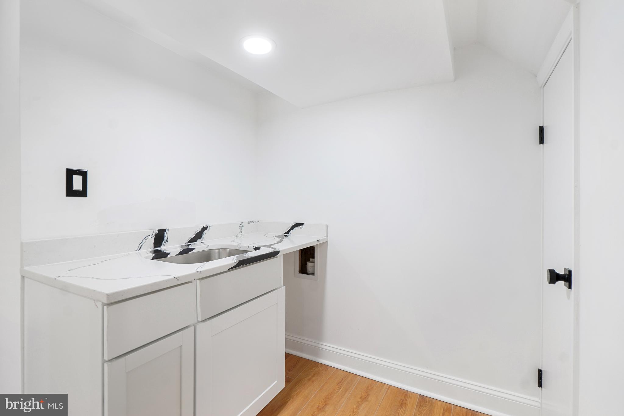 5309 Chesapeake Road Hyattsville, MD 20781 - Photo 28 of 36 a bathroom with a sink and vanity