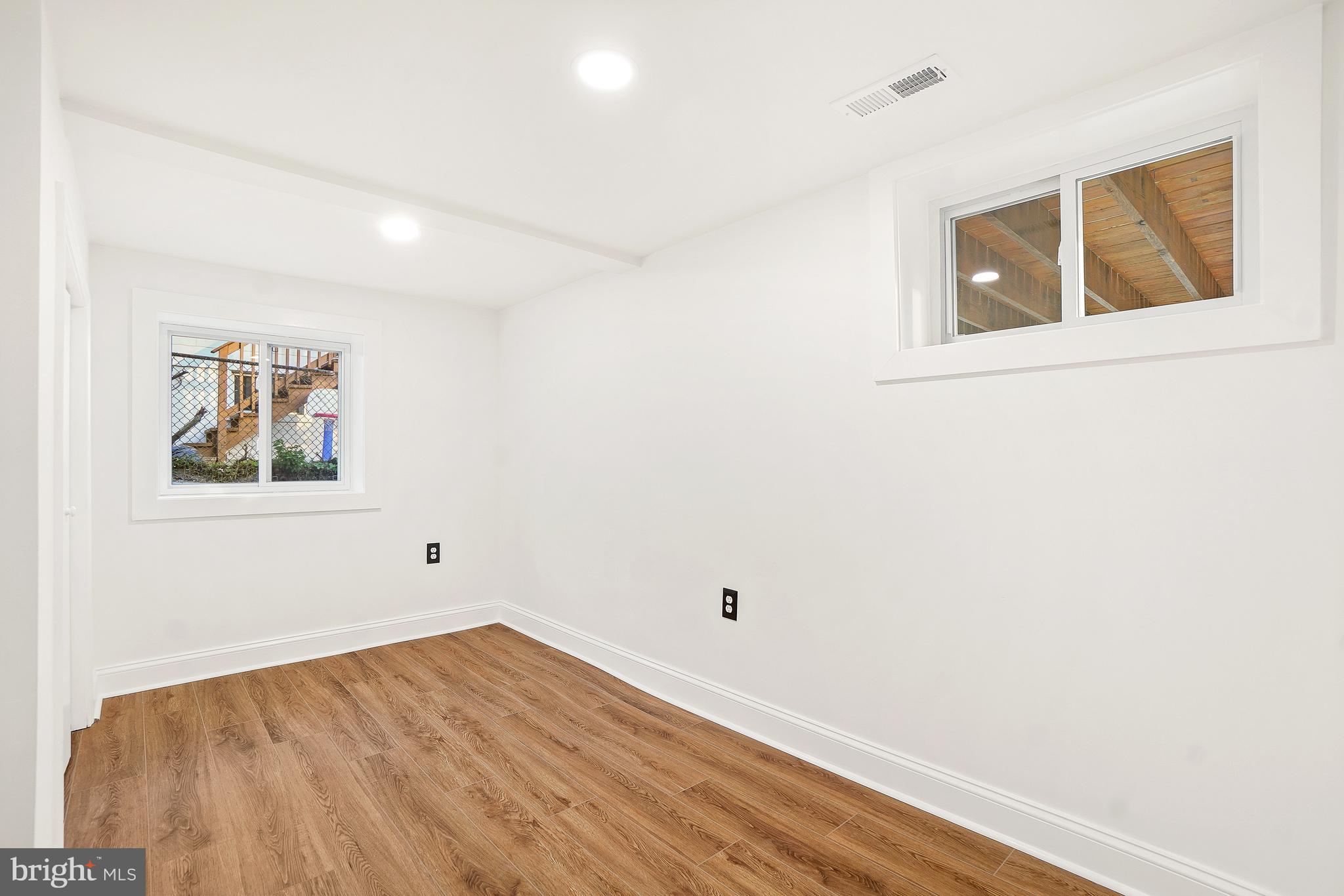 5309 Chesapeake Road Hyattsville, MD 20781 - Photo 32 of 36 a view of empty room with wooden floor and fan