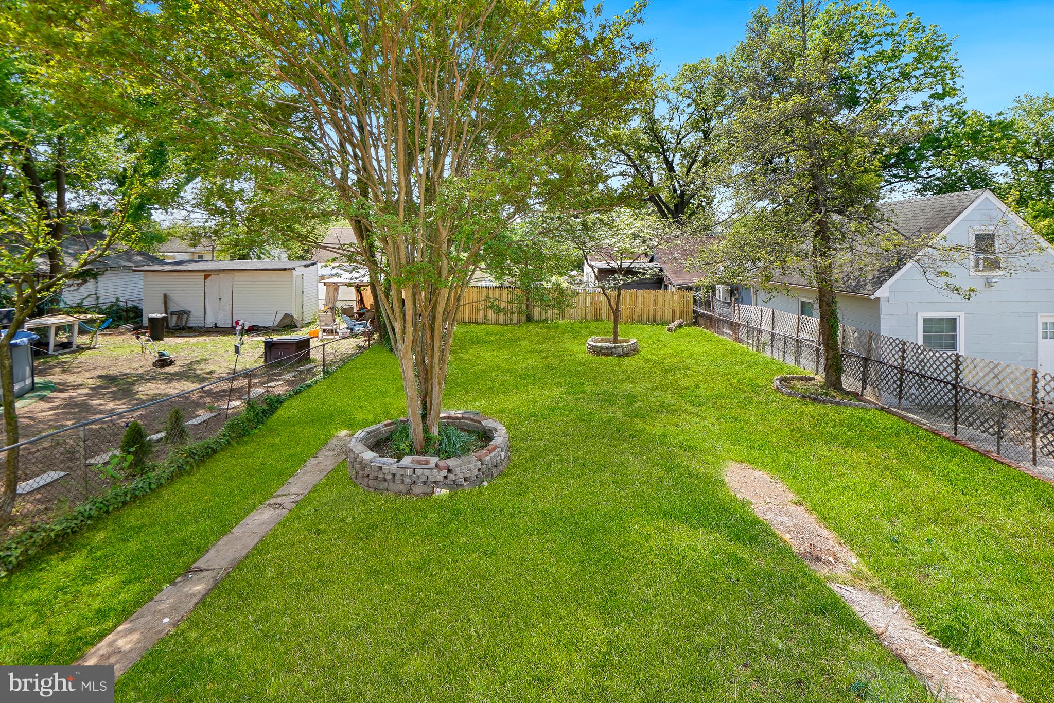 5309 Chesapeake Road Hyattsville, MD 20781 - Photo 36 of 36 a view of a backyard with table and chairs and wooden fence