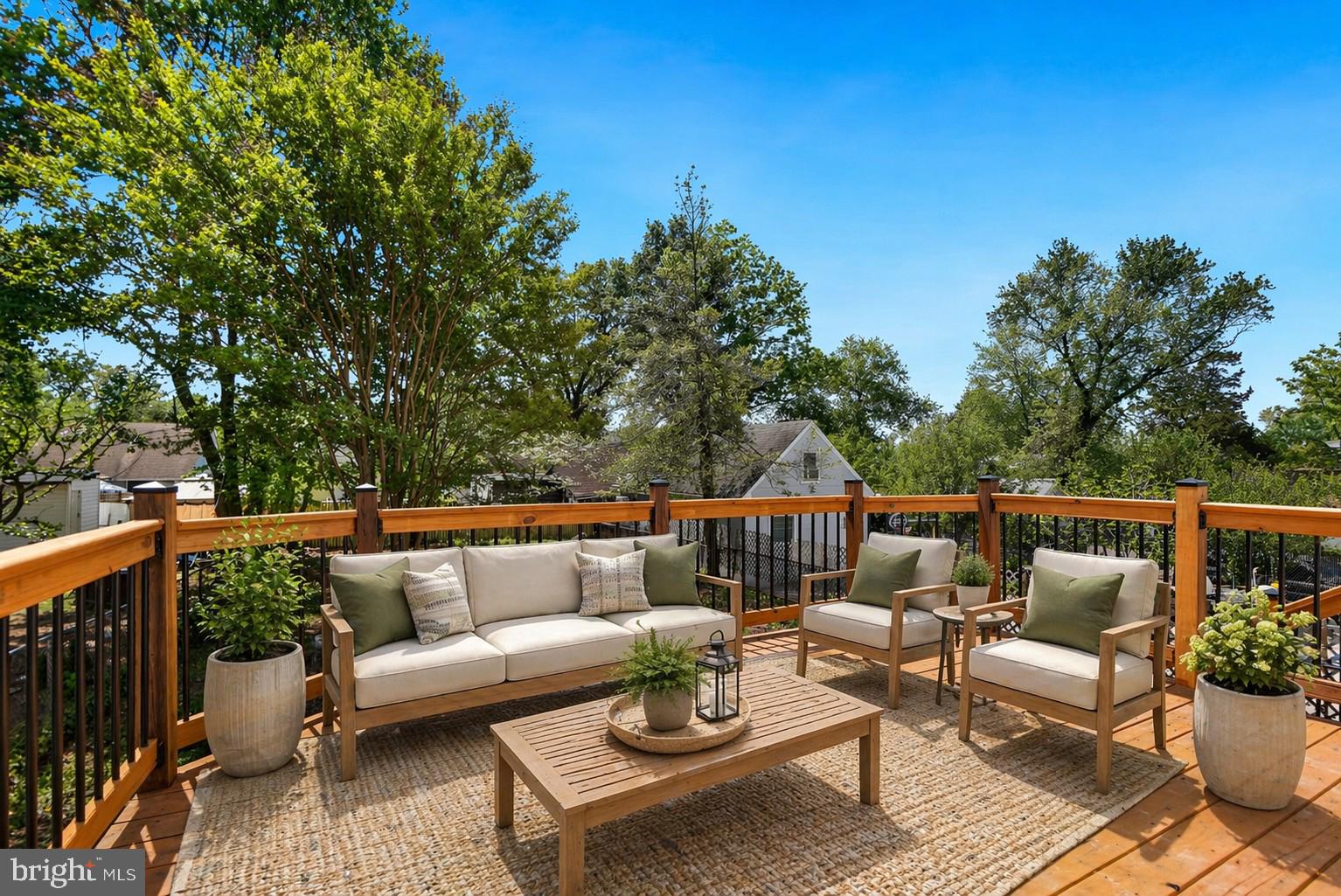5309 Chesapeake Road Hyattsville, MD 20781 - Photo 5 of 36 a balcony with wooden floor and outdoor seating